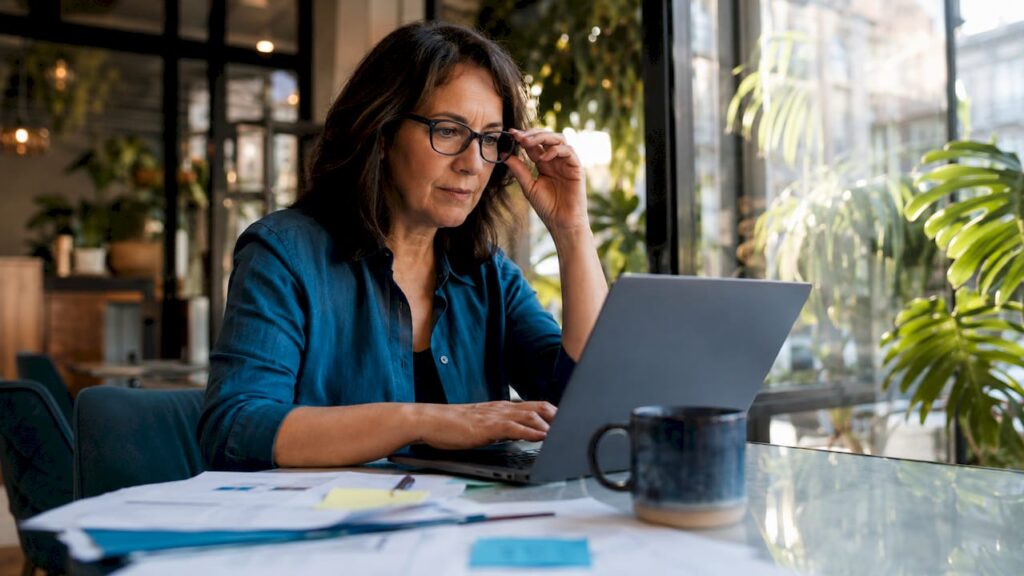 Small business owner reviewing SEO data at desk